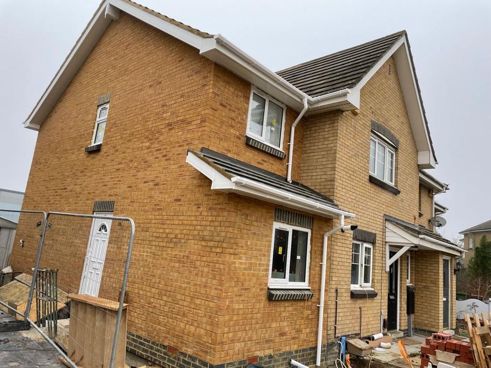 Double storey side extension in matching brickwork, under construction