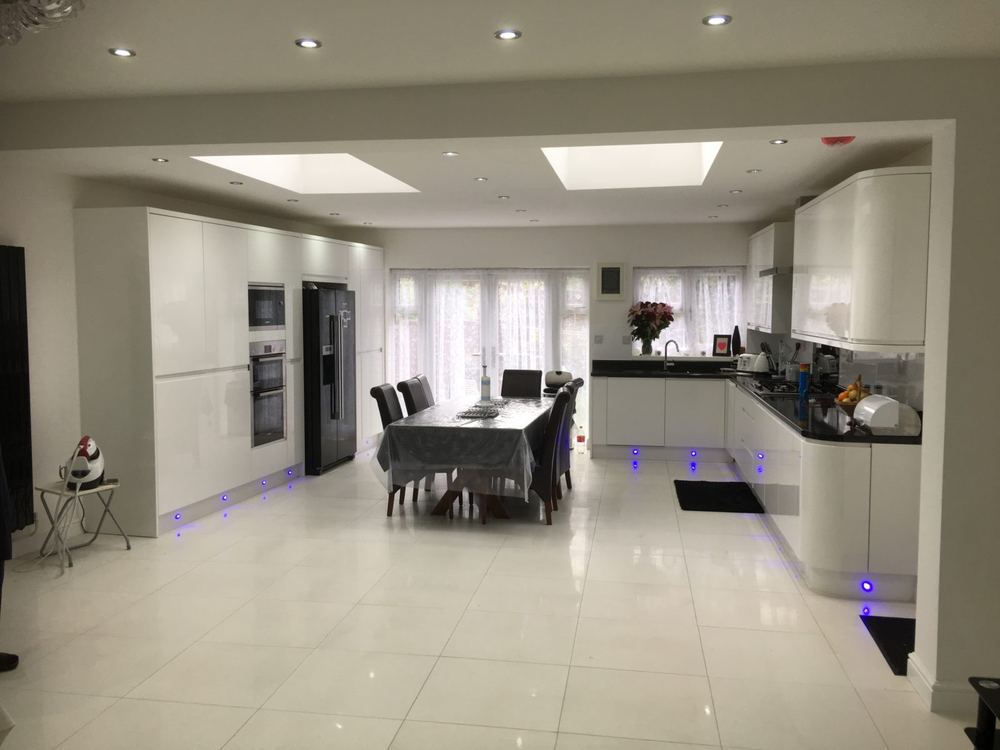 Open-plan kitchen and dining extension lit by a large roof lantern